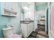 A modern bathroom with tile flooring, granite countertops and vanity at 4039 Casa Ct, Hernando Beach, FL 34607