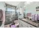 Modern bathroom with glass-enclosed shower, granite countertop, and stylish fixtures at 4039 Casa Ct, Hernando Beach, FL 34607