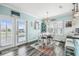 Bright dining area with outdoor access and seamless flow to kitchen at 4039 Casa Ct, Hernando Beach, FL 34607