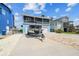 Waterfront home with two-car garage, boat, second story porch and nicely landscaped yard at 4039 Casa Ct, Hernando Beach, FL 34607