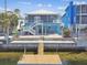 Waterfront home with a dock, patio, and inviting staircase for outdoor entertaining at 4039 Casa Ct, Hernando Beach, FL 34607