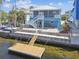 Charming coastal home with a private dock, enhancing the waterfront lifestyle and curb appeal at 4039 Casa Ct, Hernando Beach, FL 34607