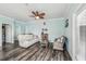 Bright living room features wood floors, ceiling fan, and comfortable seating at 4039 Casa Ct, Hernando Beach, FL 34607