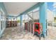 Outdoor kitchen with a grill, smoker, bar, and seating, perfect for entertaining guests outside at 4039 Casa Ct, Hernando Beach, FL 34607