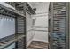 Organized walk-in closet features shelves, clothes rods, and wood floors at 4039 Casa Ct, Hernando Beach, FL 34607