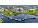 Stunning aerial perspective of the waterfront community, showcasing the building, marina, and lush landscape at 4516 Seagull Dr # 903, New Port Richey, FL 34652