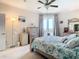 Comfortable bedroom with balcony access, complemented by tasteful decor and natural light for a serene atmosphere at 4516 Seagull Dr # 903, New Port Richey, FL 34652