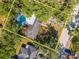 An aerial view of the property showcasing its lush backyard with pool at 4627 W Browning Ave, Tampa, FL 33629