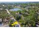 Discover a vibrant community with a serene lake, lush greenery, and stunning waterfront homes at 4627 W Browning Ave, Tampa, FL 33629