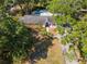 An aerial view of the property showcasing its lush backyard with pool at 4627 W Browning Ave, Tampa, FL 33629