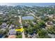 Discover a vibrant community with a serene lake, lush greenery, and stunning waterfront homes at 4627 W Browning Ave, Tampa, FL 33629