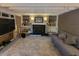 Living room with fireplace, built-in shelves, and neutral tones offers a cozy space at 4627 W Browning Ave, Tampa, FL 33629