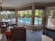 Bright sun room with a view of the pool and lush backyard at 4627 W Browning Ave, Tampa, FL 33629