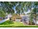 Aerial view of the home showcasing a nice backyard with a screened in lanai at 5114 Whispering Leaf Trl, Valrico, FL 33596