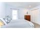 Bright bedroom featuring a comfy bed with white walls and natural light from the window at 5114 Whispering Leaf Trl, Valrico, FL 33596