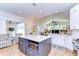 Kitchen with a view to the combined Gathering/dining room featuring an expansive center island and stainless appliances at 5114 Whispering Leaf Trl, Valrico, FL 33596