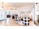 Spacious living room featuring hard surface floors and multiple seating areas with plenty of natural light at 5114 Whispering Leaf Trl, Valrico, FL 33596