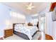 This main bedroom has beautiful hardwood floors, tray ceiling, and direct access to the lanai at 5114 Whispering Leaf Trl, Valrico, FL 33596