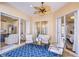 Relaxing sunroom with comfortable seating and sliding glass doors at 5114 Whispering Leaf Trl, Valrico, FL 33596