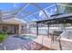 Inviting screened-in pool area with a gazebo, an outdoor kitchen and seating, ready for entertaining at 5114 Whispering Leaf Trl, Valrico, FL 33596