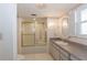 Bathroom featuring tile flooring, a large vanity, a shower over tub and a privacy window at 5200 Brittany S Dr # 1807, St Petersburg, FL 33715