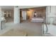 Primary bedroom suite with sitting room area featuring neutral carpet and furnishings at 5200 Brittany S Dr # 1807, St Petersburg, FL 33715