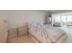 Bedroom featuring neutral carpet and furnishings with light walls and bedding at 5200 Brittany S Dr # 1807, St Petersburg, FL 33715