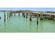 Sturdy wooden boat dock with secure pylons offers direct access to the serene waters at 5200 Brittany S Dr # 1807, St Petersburg, FL 33715
