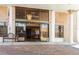 Inviting building entrance featuring glass doors, chandelier, American flag, and ample natural light at 5200 Brittany S Dr # 1807, St Petersburg, FL 33715