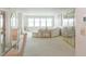 Spacious living room with lots of light, neutral carpet, and dining area at 5200 Brittany S Dr # 1807, St Petersburg, FL 33715