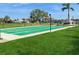 Well-maintained shuffleboard court with lush landscaping and a relaxing gazebo in the background at 5200 Brittany S Dr # 1807, St Petersburg, FL 33715