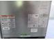 This image shows an HVAC unit with important specifications and safety guidelines visible on the exterior at 5312 Berkley Rd, New Port Richey, FL 34652