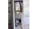 HVAC system installed in a utility closet with basic shelving, next to a partially renovated room at 5312 Berkley Rd, New Port Richey, FL 34652