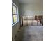Spacious living room renovation featuring a large window that lets in natural light and exposed wall studs at 5312 Berkley Rd, New Port Richey, FL 34652