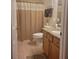 Cozy bathroom features a granite countertop, modern toilet, and a shower with a decorative curtain at 584 52Nd N Ave, St Petersburg, FL 33703