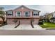 Charming townhome with two stories, garage, balconies, and manicured landscaping at 584 52Nd N Ave, St Petersburg, FL 33703