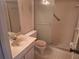 Bathroom with essential fixtures: a vanity, toilet, and standing shower at 5970 80Th N St # 312, St Petersburg, FL 33709