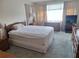 Relaxing bedroom featuring neutral walls, soft carpet, and well-lit ambiance at 5970 80Th N St # 312, St Petersburg, FL 33709