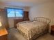 Inviting bedroom with large window that welcomes natural light and cozy carpet at 5970 80Th N St # 312, St Petersburg, FL 33709