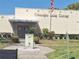 Oleander Lake Center building with a flag and well-maintained landscaping at 5970 80Th N St # 312, St Petersburg, FL 33709
