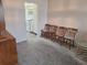 Spacious carpeted living room leading to a kitchen with views of the dining area at 5970 80Th N St # 312, St Petersburg, FL 33709