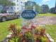 Lexington community sign with flamingo decorations and a well-maintained lawn at 5970 80Th N St # 312, St Petersburg, FL 33709