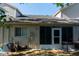 Backyard with a patio, light colored exterior, and green foliage and trees at 6516 Remus Dr, New Port Richey, FL 34653