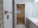 Hall bathroom with vanity and view into bedroom at 6516 Remus Dr, New Port Richey, FL 34653