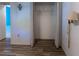 Empty closet with bifold doors and a hanging rod in a room with wood flooring at 6516 Remus Dr, New Port Richey, FL 34653