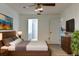 Comfortable main bedroom boasts a ceiling fan and a private bathroom entrance at 6516 Remus Dr, New Port Richey, FL 34653