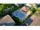 Aerial view of a community pool with ample seating and a covered patio, surrounded by well-maintained landscaping at 6516 Remus Dr, New Port Richey, FL 34653