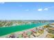 Stunning aerial view showcasing lush greenery, shimmering waterways, and a vibrant cityscape at 7600 Bayshore Dr # 1206, Treasure Island, FL 33706