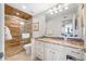 Elegant bathroom with glass shower doors and granite countertop at 7600 Bayshore Dr # 1206, Treasure Island, FL 33706