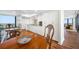 Spacious dining area, offering seating, hardwood floors and views into the kitchen at 7600 Bayshore Dr # 1206, Treasure Island, FL 33706